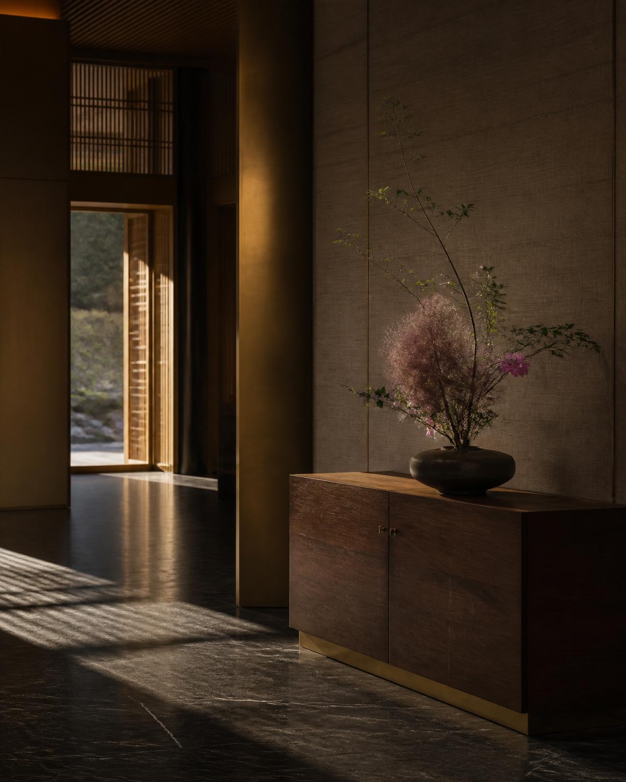 A quiet luxury lounge interior with brass, walnut and soft afternoon light